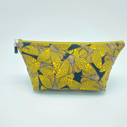 black and gold graphic moth zippered bag